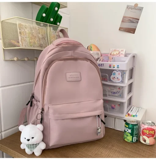 Mochila espaçosa estudante japonesa Mochila feminina simples e versátil Material de poliéster unissex Decoração de boneca